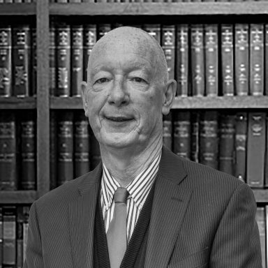 A bookshelf containing volumes of books about Irish Law.